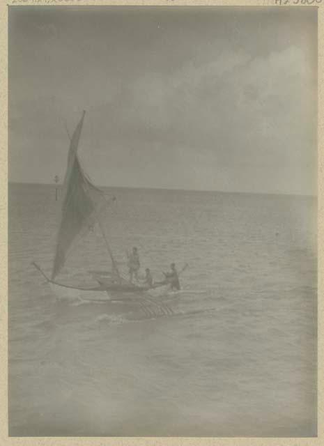 People in outrigger canoe