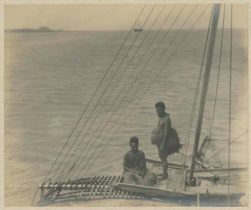 People in outrigger canoe