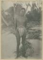 Man standing in front of palms