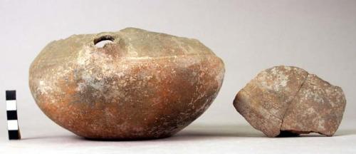 Vessel (in fragments) with broken spout.