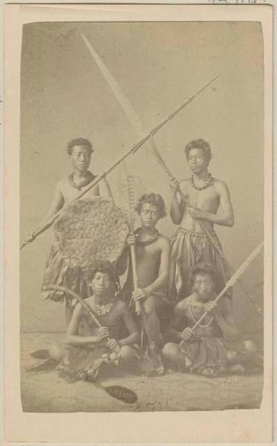 Studio portrait of group of warriors with non-Hawaiian weapons