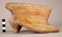 Fragmentary tetrapod dish orange ware