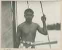 Man standing by a  sail