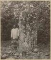 Man standing by latte stone