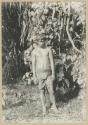 Man standing in front of tree