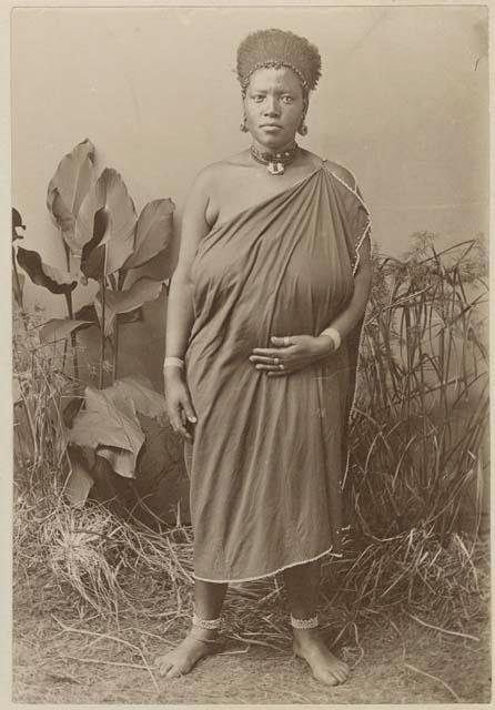 Woman standing in front of plants