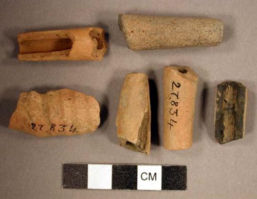 Ceramic, earthenware pipe fragments, four undecorated stems, one undecorated mouthpiece, and one incised bowl