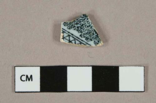 Black transferprinted earthenware vessel body fragment, white or light buff paste, lead glazed