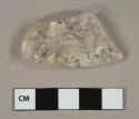 Colorless glass vessel body fragment, likely lid fragment