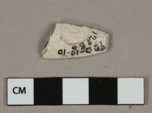 White kaolin pipe bowl fragment, unglazed, illegible stamp