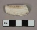 White kaolin molded pipe bowl fragment