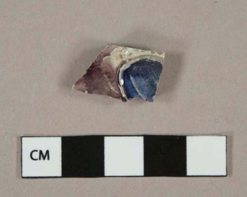 Gray salt glazed stoneware vessel body fragment, cobalt and manganese decorated, molded decoration, gray paste