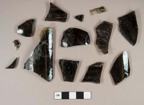 Olive green bottle glass fragments, including three base fragments