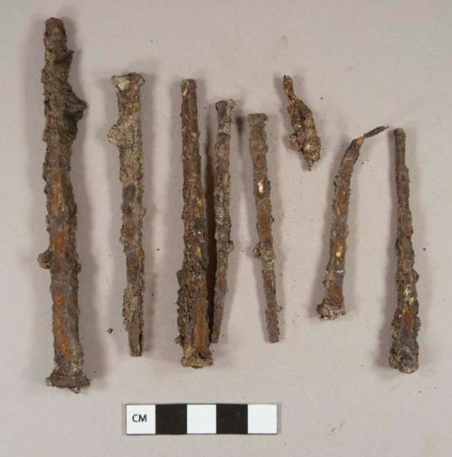 Cut or wrought iron nail fragments; unidentified iron fragments