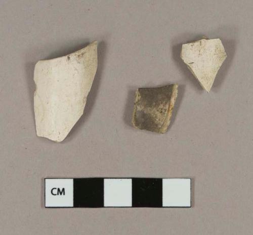 Smoked, undecorated pipe bowl fragments; smoked pipe bowl fragment with stamped cartouche