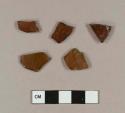 Glass, amber bottle glass fragments; molded amber bottle glass fragment