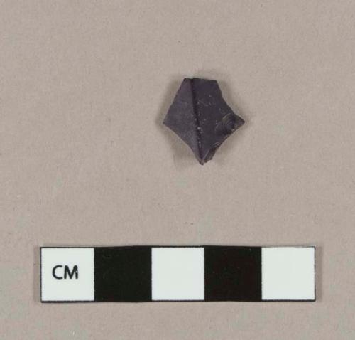 Faceted purple bottle glass fragment