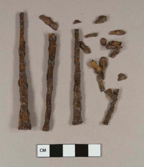 Iron nail fragments, some cut or wrought; iron nail fragment with brick fragment attached; unidentified iron fragments