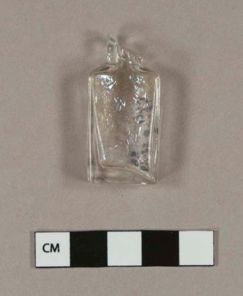 Nearly complete rectangular colorless glass bottle