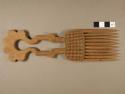 Comb, Carved dark wood with elaborate carved handle