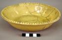 Tan china bowl.  7 1/2' in diameter; restored