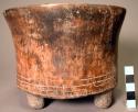 Straight-sided flat-bottomed pottery tripod bowl- incised decoration around base