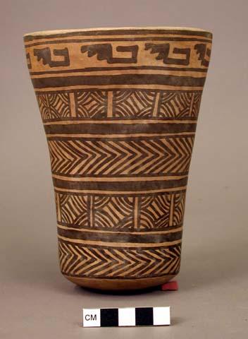 Vase painted with rows of black geometric patterns