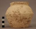 Small cream colored ware urn