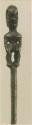 Carved wooden staff with anthropomorphic figure, front