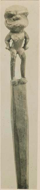 Carved wooden staff with anthropomorphic figure, front