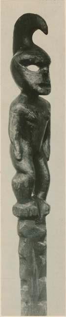 Carved wooden staff with anthropomorphic figure, side