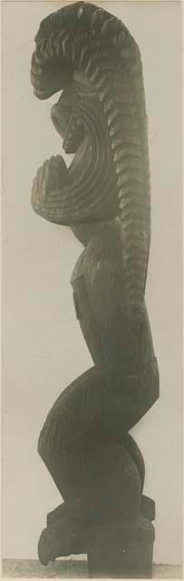 Carved wood anthropomorphic figure, side