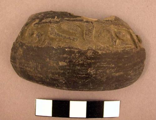 Black stamped potsherd - Type VI