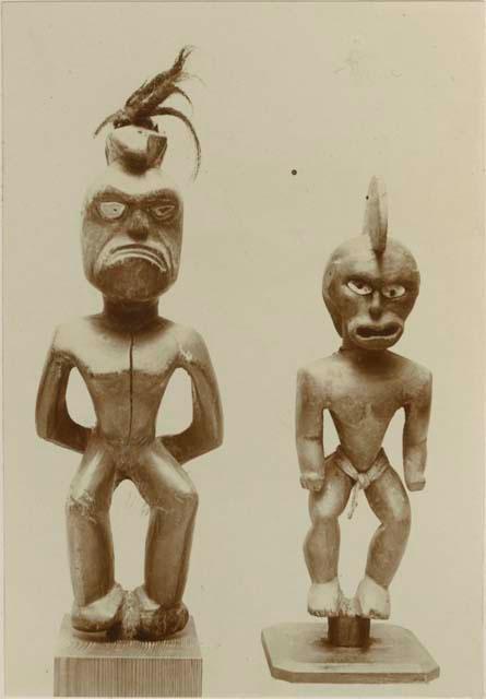 Two anthropomorphic figures, one with feathers