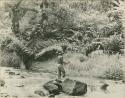 Man crossing river