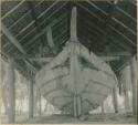 Boat stored under woven roof