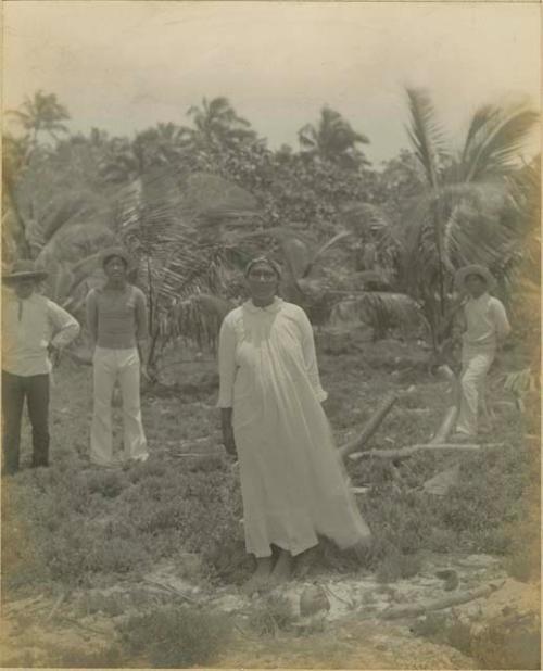 Woman and three men in clearing