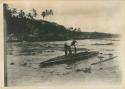 Man in outrigger canoe