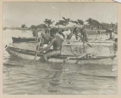 Men and canoes