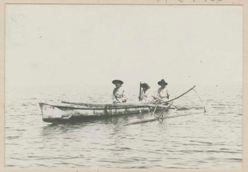 Men in outrigger canoe