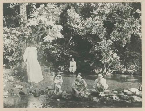 Women and girls in creek