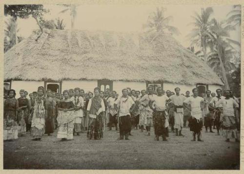 Group dancing in front of building