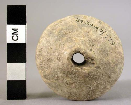 Spindle whorl of baked clay