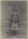 Man in front of woven tapestry