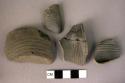 Fragments of pottery cups, profilated and plain