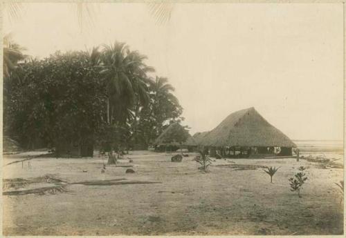 Large thatched structures along shore