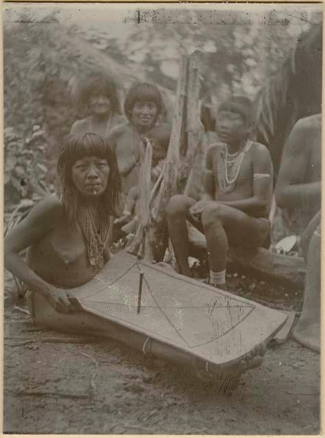 Woyawoi woman making grater