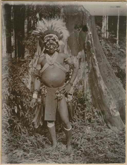 Man standing in front of a tree