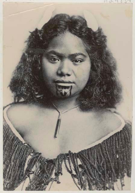 Studio portrait of woman with facial tattoos