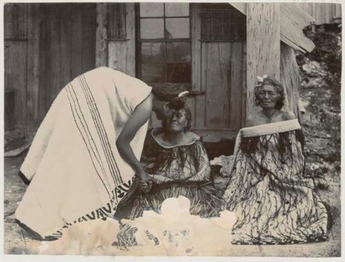 Three women in front of building